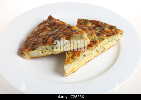 Slices of Spanish omelet or tortilla de patatas on a white plate Stock Photo