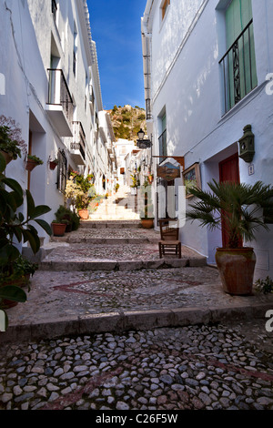 A street of steps in the picturesque village of Frigiliana, near Nerja, Malaga Province, Andalusia, Andalucia southern Spain Stock Photo