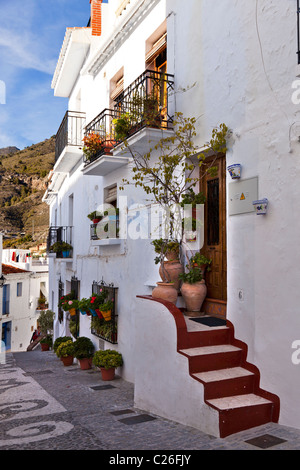 A street of steps in the picturesque village of Frigiliana, near Nerja, Malaga Province, Andalusia, Andalucia southern Spain Stock Photo