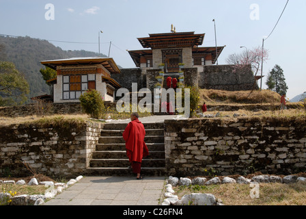 Monks at the entrance of the monastery, Trashi Yangtse, East Bhutan Stock Photo