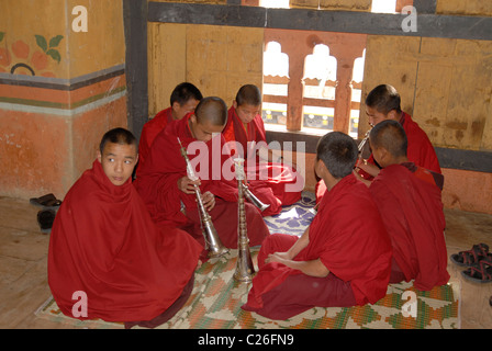 Young monks with their instruments inside the monastery in Trashiyangtse, East Bhutan Stock Photo