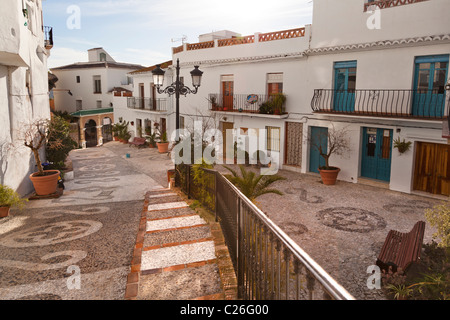 A street in the picturesque village of Frigiliana, near Nerja, Malaga Province, Andalusia, Andalucia southern Spain Stock Photo