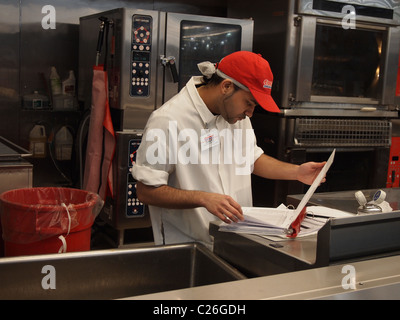 A Hispanic American male employee of Costco Wholesale, a USA big box chain store, March 24, 2011, Katharine Andriotis Stock Photo