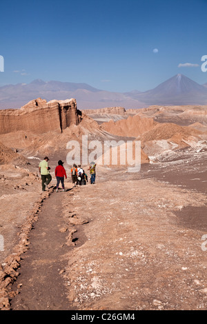 Tourists walking along path in Valle De La Luna, Atacama, San Pedro, Chile, South America. Stock Photo