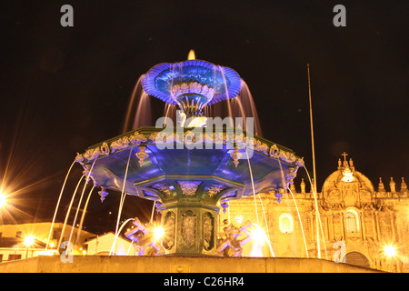 Blue fountain at night in Plaza de Armas, Cusco Stock Photo