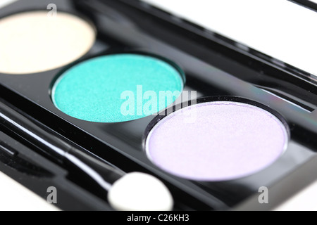Make-up eyeshadows with brush, closeup on white Stock Photo