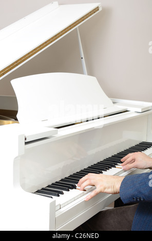 Piano detail with players hands Stock Photo