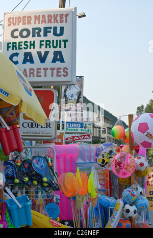 Roadside seaside supermarket in Corfu selling beach balls, inflatables, fishing nets, buckets and spades. Stock Photo
