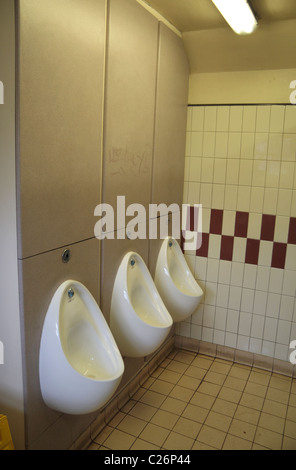 Urinals in a public toilet (mens room) in Richmond Park, Surrey, UK. Stock Photo