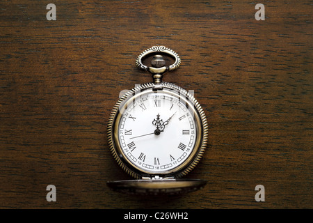 Pocket watch on wooden background Stock Photo