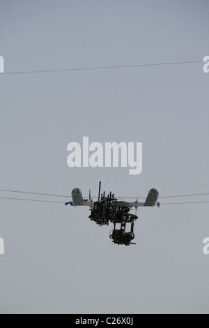 overhead tv camera on wire at sports event Stock Photo