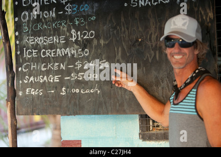 Kiritimati, Kiribati, Christmas Island, Brad checking out island store prices Stock Photo