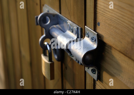 Secure padlocked bolt Stock Photo