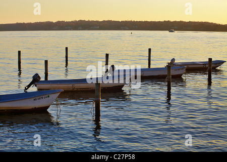Rental boats align in their moorings on the Patuxent River, Solomon’s Island, Maryland. Stock Photo