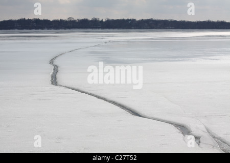 A split in a frozen lake. Stock Photo