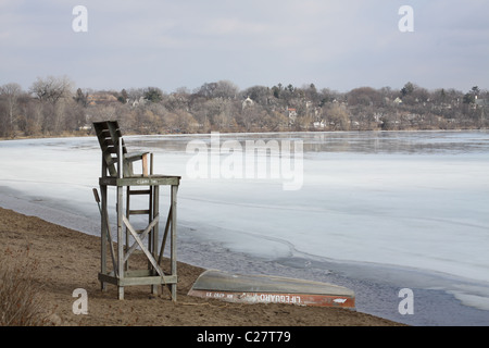 An empty lifeguard stand looking out over a frozen lake in Minneapolis.
