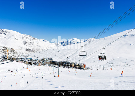 Chairlift and view over the resort centre from Costa Rodona, Pas de la Casa, Grandvalira Ski Area, Andorra Stock Photo