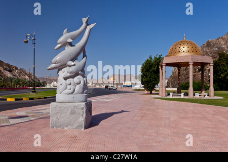 Aquatic dolphin sculptures on the Corniche promenade in Muscat, Oman. Stock Photo