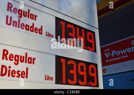 A sign displays the price of petrol at 134.9 pence per litre for unleaded fuel. Outside a Shell garage in London. Stock Photo
