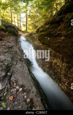 Water spills over the Blueberry Slides waterfall in Maine's western mountains, White Mountains National Forest. Stock Photo