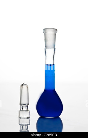 Laboratory flask with blue liquid isolated on white background Stock Photo