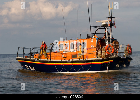 An RNLI Lifeboat 12-004 RNLB Royal Shipwright seen here launching on a shout to rescue at Cromer,UK Stock Photo