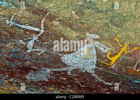 Aboriginal rock art depicts figures of Mimi Spirits on a cave wall ...