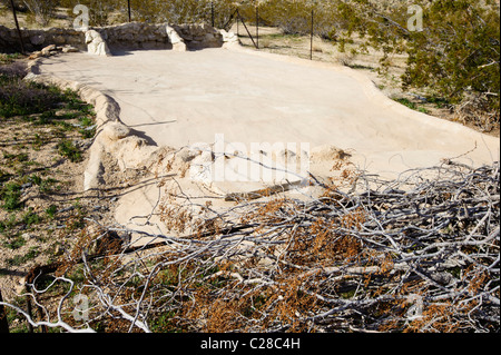 The concrete apron that collects water on a Wildlife Guzzler in the Mojave Desert Stock Photo