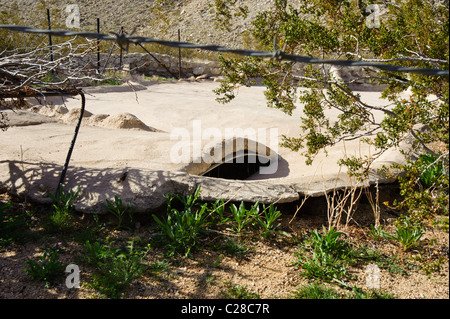 Entrance to a Wildlife Guzzler in the Mojave Desert.  This is where birds and small animals can enter for water. Stock Photo