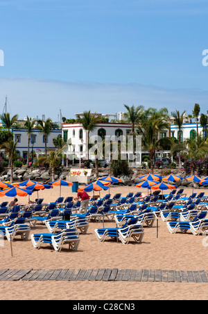Deck chairs on the beach at Puerto Mogan in Gran Canaria Stock Photo