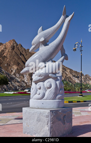 Aquatic dolphin sculptures on the Corniche promenade in Muscat, Oman. Stock Photo