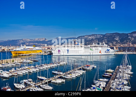 The Ibero Cruises cruise ship Grand Holiday in Toulon, berthed beside Corsica and Sardinia Ferries' ferry Mega Express Five Stock Photo