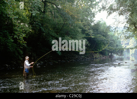 Fly fisherman casting his line in a stream in Fairmount Park, Philadelphia, Pennsylvania, USA Stock Photo