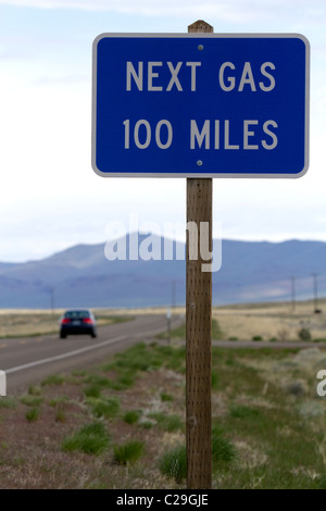 Next gas 100 miles road sign at the Oregon/Nevada border in McDermitt, USA. Stock Photo