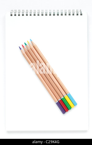 Colour pencils on a drawing pad Stock Photo