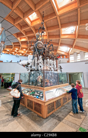 Visitors interacting with the plant processor exhibit in the Core at the Eden Project  Bodelva, St Austell, Cornwall, England Stock Photo