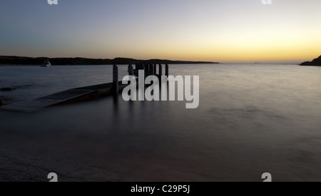 Jetty in late evening sunset. Stock Photo