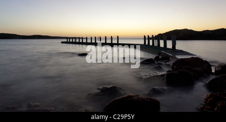 Jetty in late evening sunset. Stock Photo