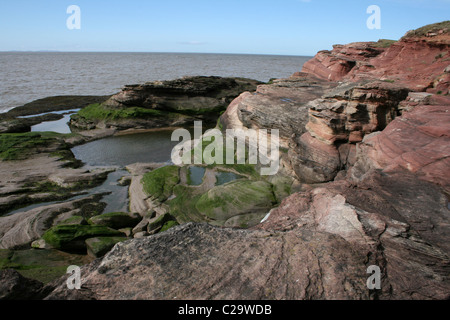 Coastal Cliffs And Rockpools On Hilbre Island, Wirral, UK Stock Photo