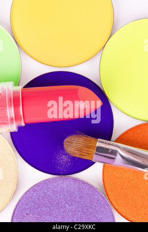 Make-up brush and lipstick on professional eyeshadows palette, closeup Stock Photo