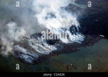 Aerial view of fire and damage in Kesennuma, Miyagi Prefecture after a 9. 0 magnitude earthquake and subsequent tsunami Stock Photo
