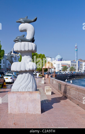 Aquatic dolphin sculptures on the Corniche promenade in Muscat, Oman. Stock Photo