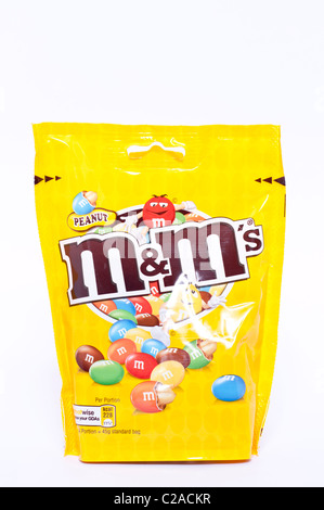 opened packet of crispy M&Ms with contents spilt to spell letters M  isolated on white background Stock Photo - Alamy