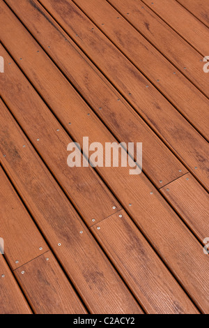 New timber decking by the side of a swimming pool Stock Photo