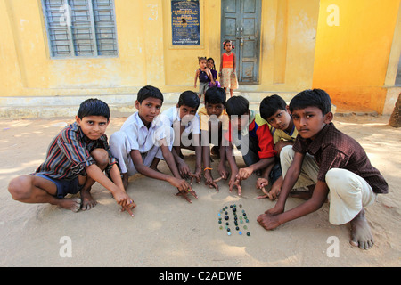 Indian boys playing with marbles Andhra Pradesh South India Stock Photo