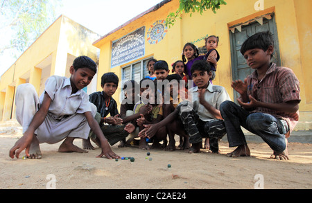 Indian boys playing with marbles Andhra Pradesh South India Stock Photo