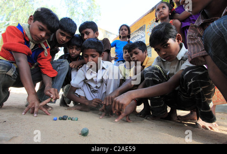 Indian boys playing with marbles Andhra Pradesh South India Stock Photo