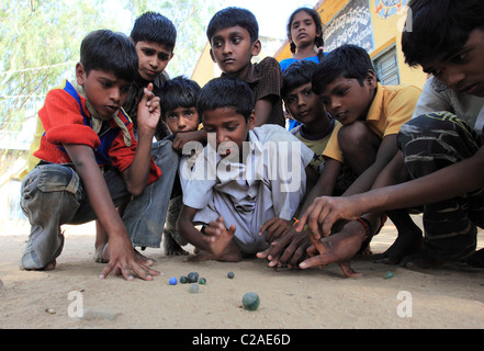 Indian boys playing with marbles Andhra Pradesh South India Stock Photo