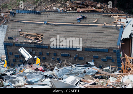 Japanese search and rescue teams search for survivors after the 2011 Tsunami in Ofunato, Japan, 2011. Stock Photo