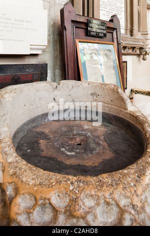 The remains of a 15th century baptismal font in Holy Trinity church, Stratford upon Avon, Warwickshire, England, UK Stock Photo